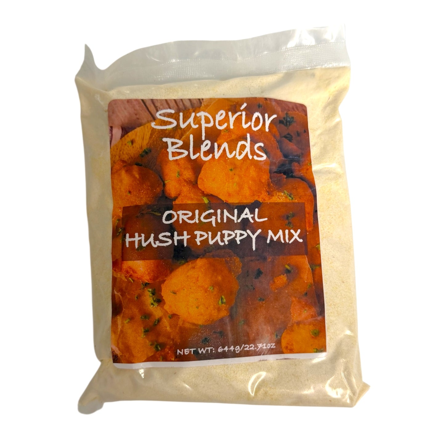 A bag of 'Superior Blends Original Hush Puppy Mix' containing a light beige powder, shown against a plain white background. The packaging features a clear plastic bag with a large front label depicting roasted sweet potatoes and the text 'Superior Blends' and 'Original Hush Puppy Mix'.
